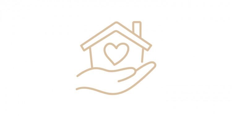 Maison avec un coeur dans une main